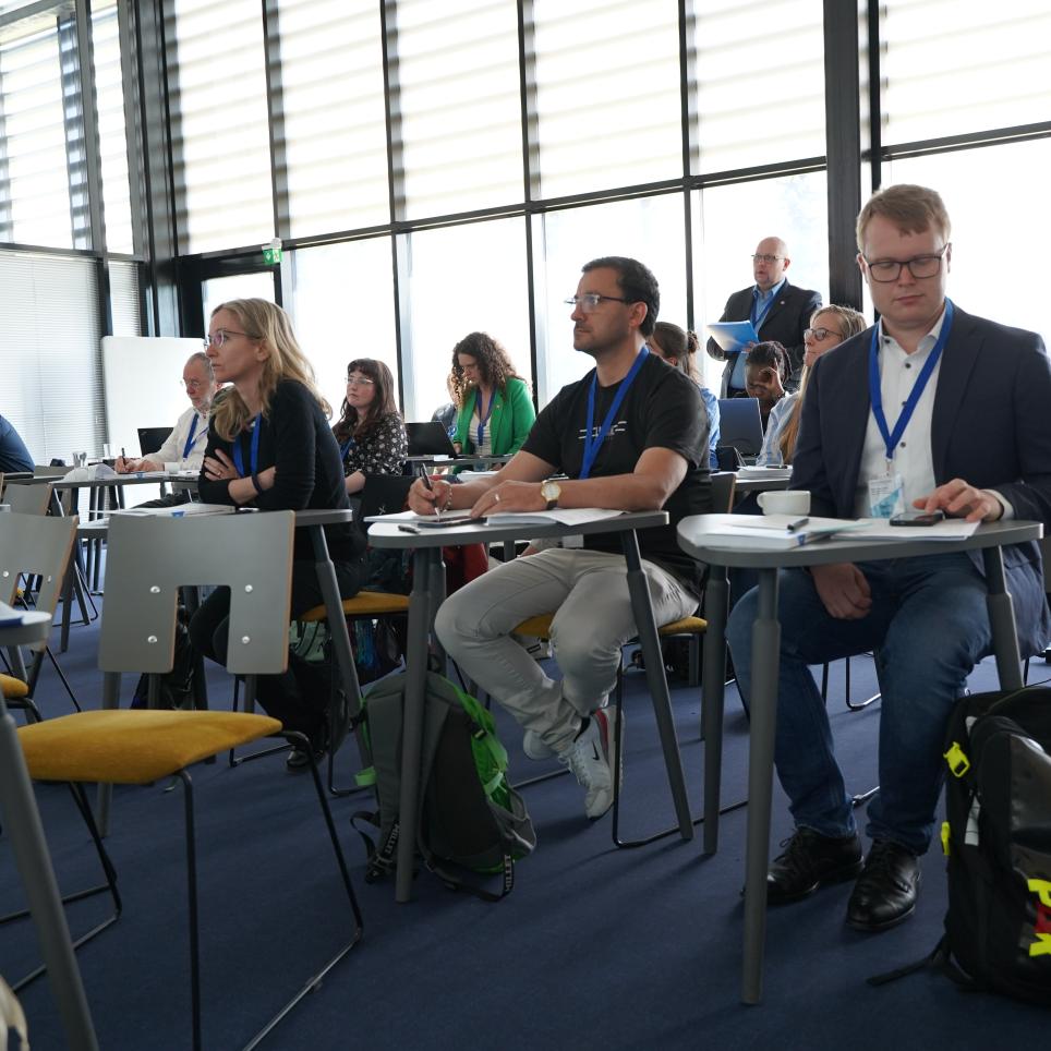 Workshop participants listening attentively to a presentation.