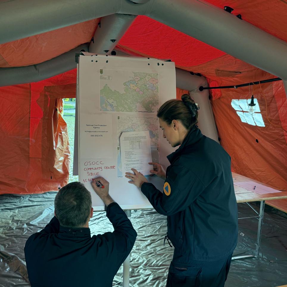 LEMA staff prepare the maps and information on the situation.
