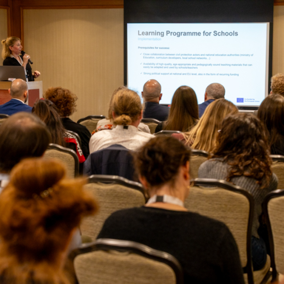 BE representative presents to the audience the concept 'Learning programme for schools" 