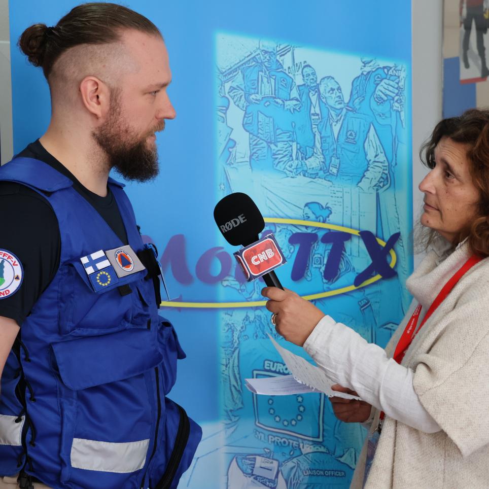 Participants are interviewed by local media (roleplayed in exercise).