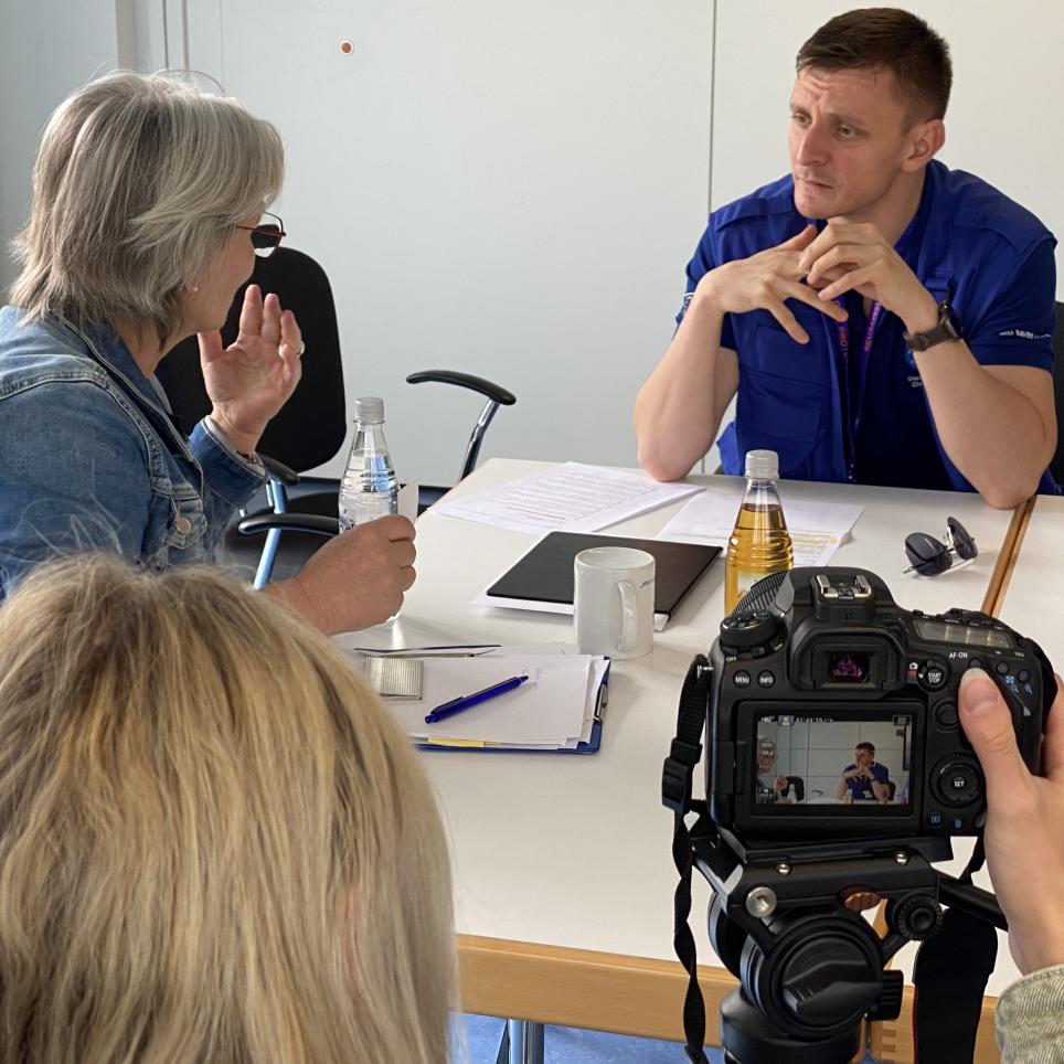 Participants are interviewed by the local media.