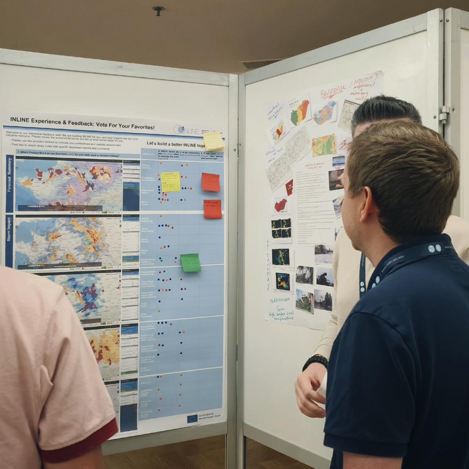 Stakeholders and project's partners discuss scientific displays and technical breakthroughs during the dedicated poster session at the INLINE workshop in Lisbon.