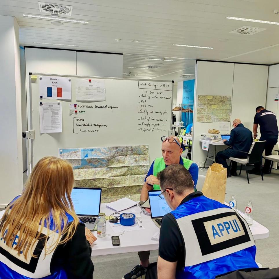 Modules at their workspace, discussing exercise with Coach/Trainer