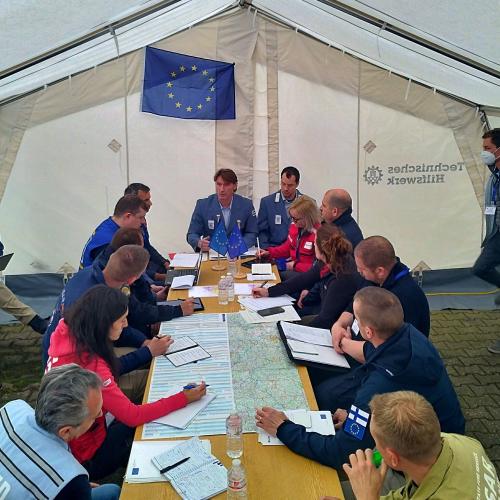 Meeting in a tent between participants and LEMA organisation in the Modules Table Top Exercise