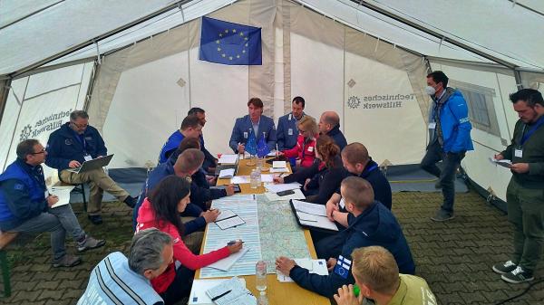 Meeting in a tent between participants and LEMA organisation in the Modules Table Top Exercise