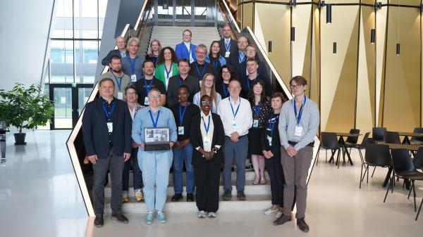 Workshop participants standing on the staircase in the hallway of the Estonian Academy of Security Sciences.